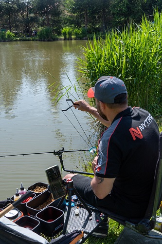 An angler feeder fishing